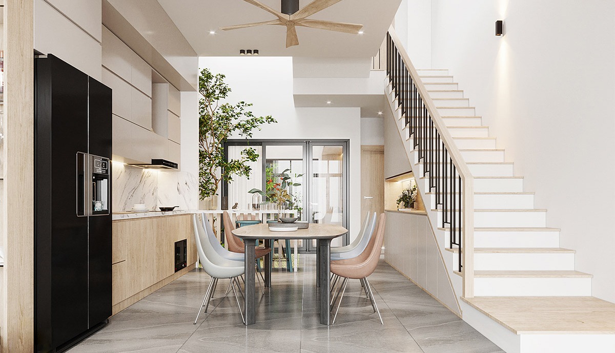 cau-thang-doc-la-gi Không gian bếp hiện đại với tông màu sáng, bàn ăn gỗ và cầu thang gỗ sang trọng.