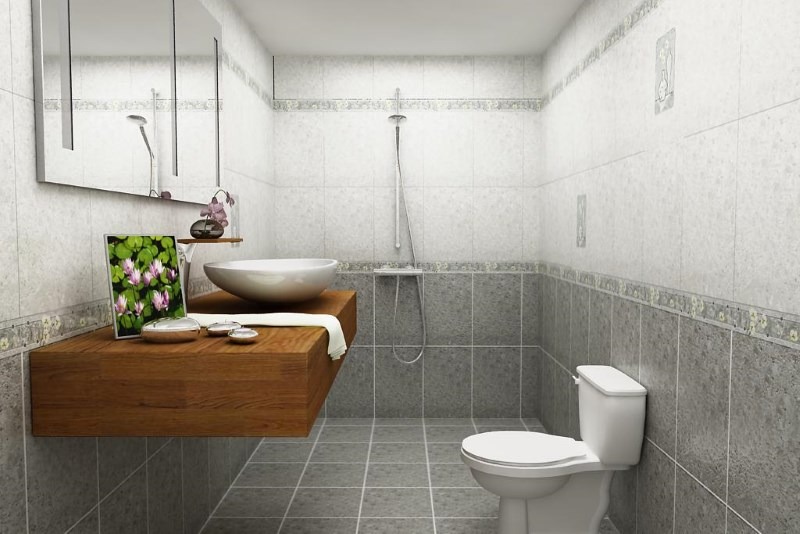 Phòng tắm hiện đại với bồn rửa chén, toilet, và gương, tông màu xám trang nhã, thiết kế tối giản và sang trọng.