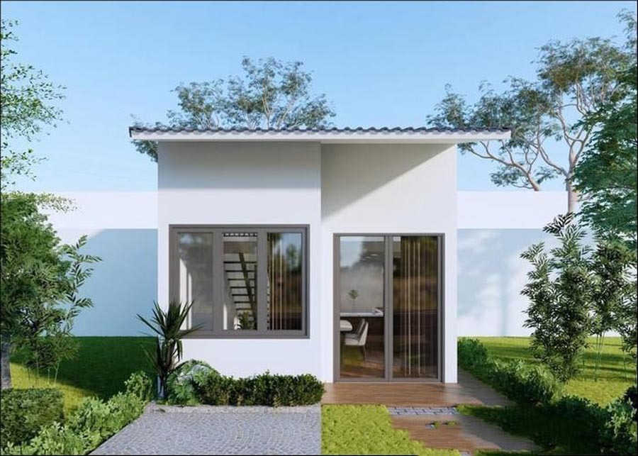 Ngôi nhà nhỏ hiện đại với sân vườn xanh, có cửa kính lớn và mái bằng, dưới bầu trời trong xanh.