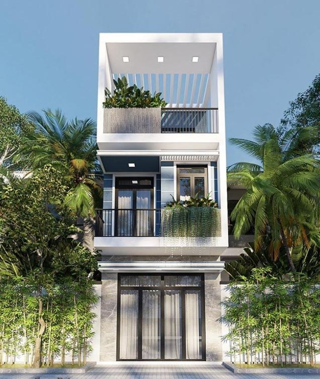 Nhà phố hiện đại ba tầng với cây cảnh xanh mát, thiết kế mở và ban công thoáng đãng.