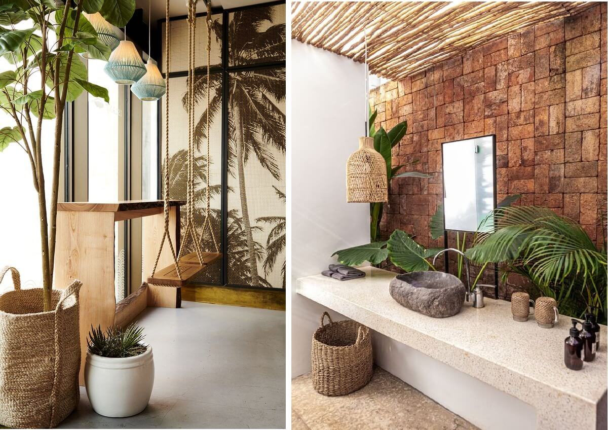 Không gian nội thất nhiệt đới với xích đu gỗ và bồn rửa mặt đá tự nhiên.
