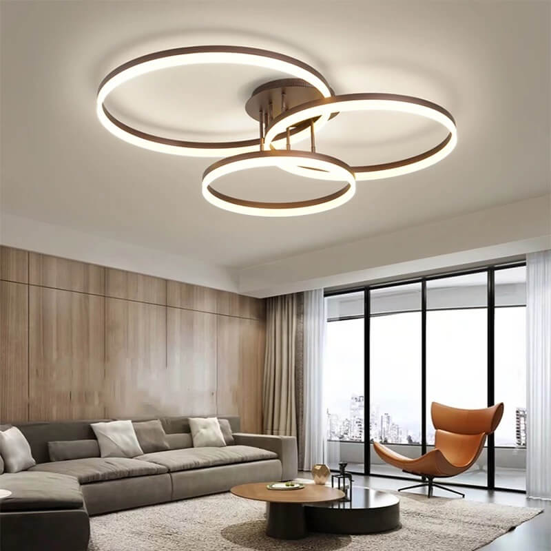 chon-he-thong-den-hien-dai-cho-phong-khach-2 Đèn trần LED hình tròn hiện đại trong phòng khách với sofa và ghế thư giãn phong cách.