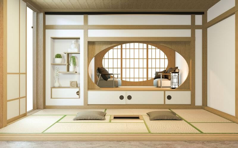 Phòng trà kiểu Nhật Bản với chiếu tatami, cửa sổ lớn, trang trí tinh tế và đệm ngồi trên sàn.