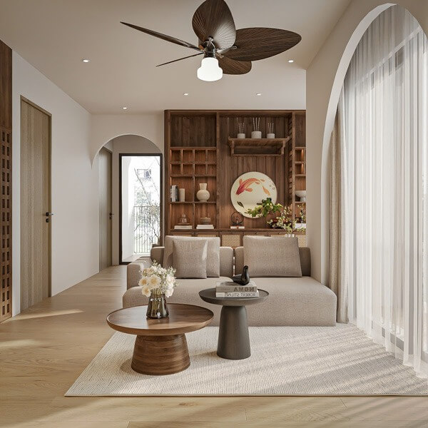 Phòng khách phong cách Nhật Bản với sofa nâu, bàn trà gỗ và kệ sách trang trí tinh tế.