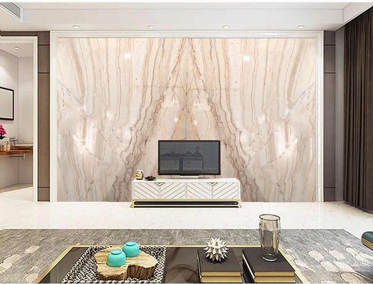 Phòng khách hiện đại với tường đá hoa, bàn cà phê sang trọng và tivi màn hình phẳng.