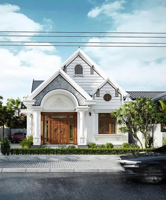 Ngôi nhà một tầng hiện đại với cửa gỗ lớn, mặt tiền trang nhã và cây xanh trang trí phía trước.