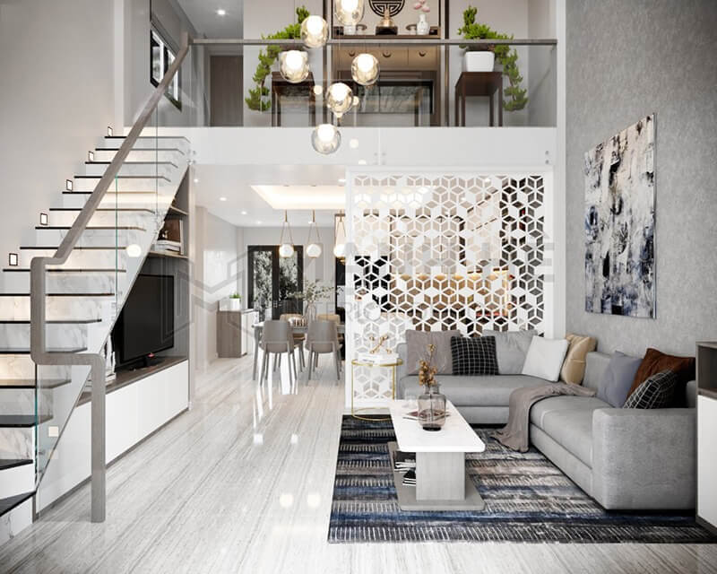 Phòng khách hiện đại với nội thất sang trọng, cầu thang kính và tranh trang trí trên tường.