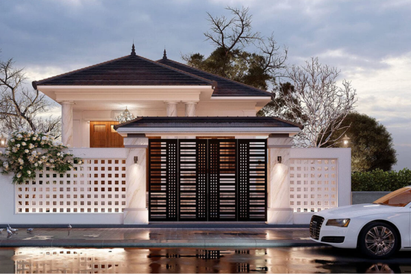 Biệt thự hiện đại với cổng sắt và xe ô tô sang trọng đậu phía trước vào buổi chiều tối.