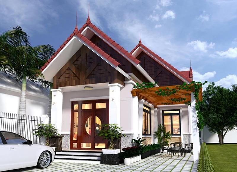 du-toan-chi-phi-xay-dung-va-phat-sinh Nhà mái thái hiện đại có sân vườn, cửa gỗ và cây xanh. Xe hơi đậu trước nhà, bầu trời trong xanh có mây nhẹ.