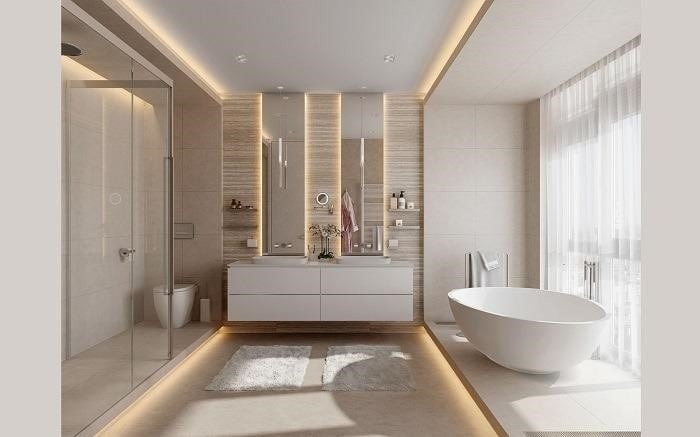 Phòng tắm hiện đại với bồn tắm tròn, tủ lavabo và ánh sáng tự nhiên từ cửa sổ lớn.