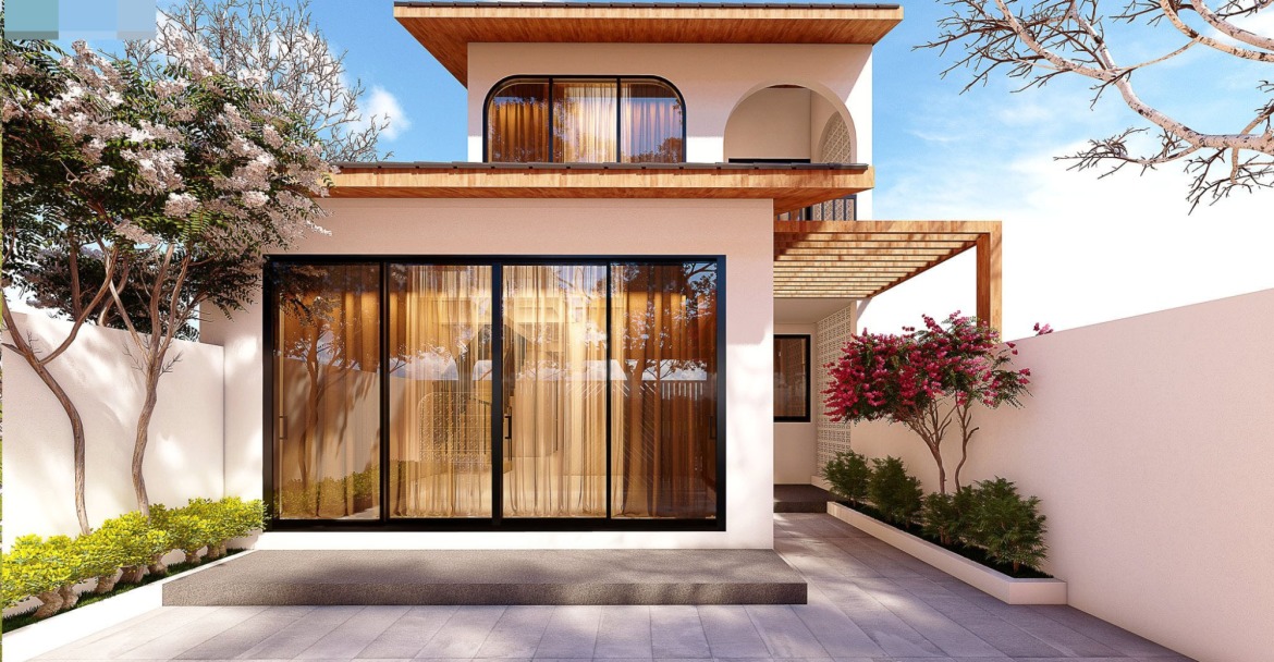 huong-nha-cho-tuoi-dinh-dau Nhà tầng hiện đại với cửa kính lớn, sân vườn, và cây xanh xung quanh, dưới bầu trời trong xanh.