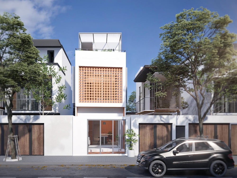 Nhà phố hiện đại 3 tầng với ô cửa gỗ, cây xanh trước nhà, xe ô tô đen đậu trên đường.