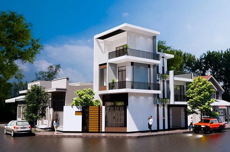 Nhà phố hiện đại ba tầng với ban công xanh mát và xe hơi đỗ trước, nổi bật giữa khu dân cư xanh.