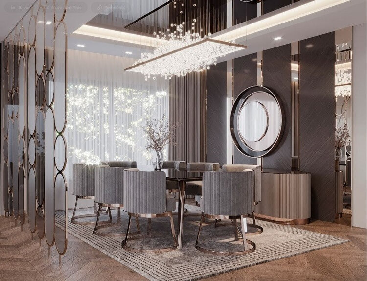 Phòng ăn sang trọng với ghế xám, bàn gỗ và đèn chùm pha lê, không gian hiện đại và ấm cúng.