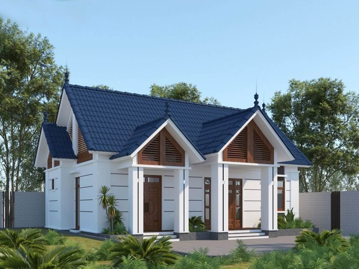 Nhà cấp 4 hiện đại với mái ngói xanh, sân vườn xanh tươi và thiết kế thoáng đãng trong khu vực nhiều cây xanh.