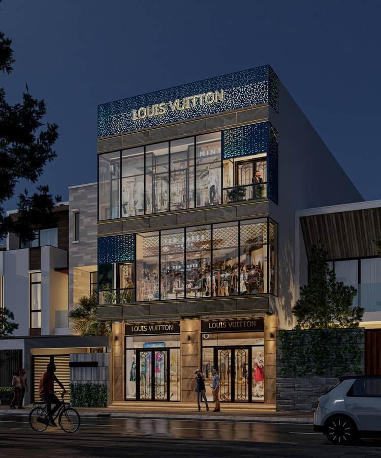 Cửa hàng Louis Vuitton sang trọng, chiếu sáng vào ban đêm với bảng hiệu sáng rực trên phố nhộn nhịp.