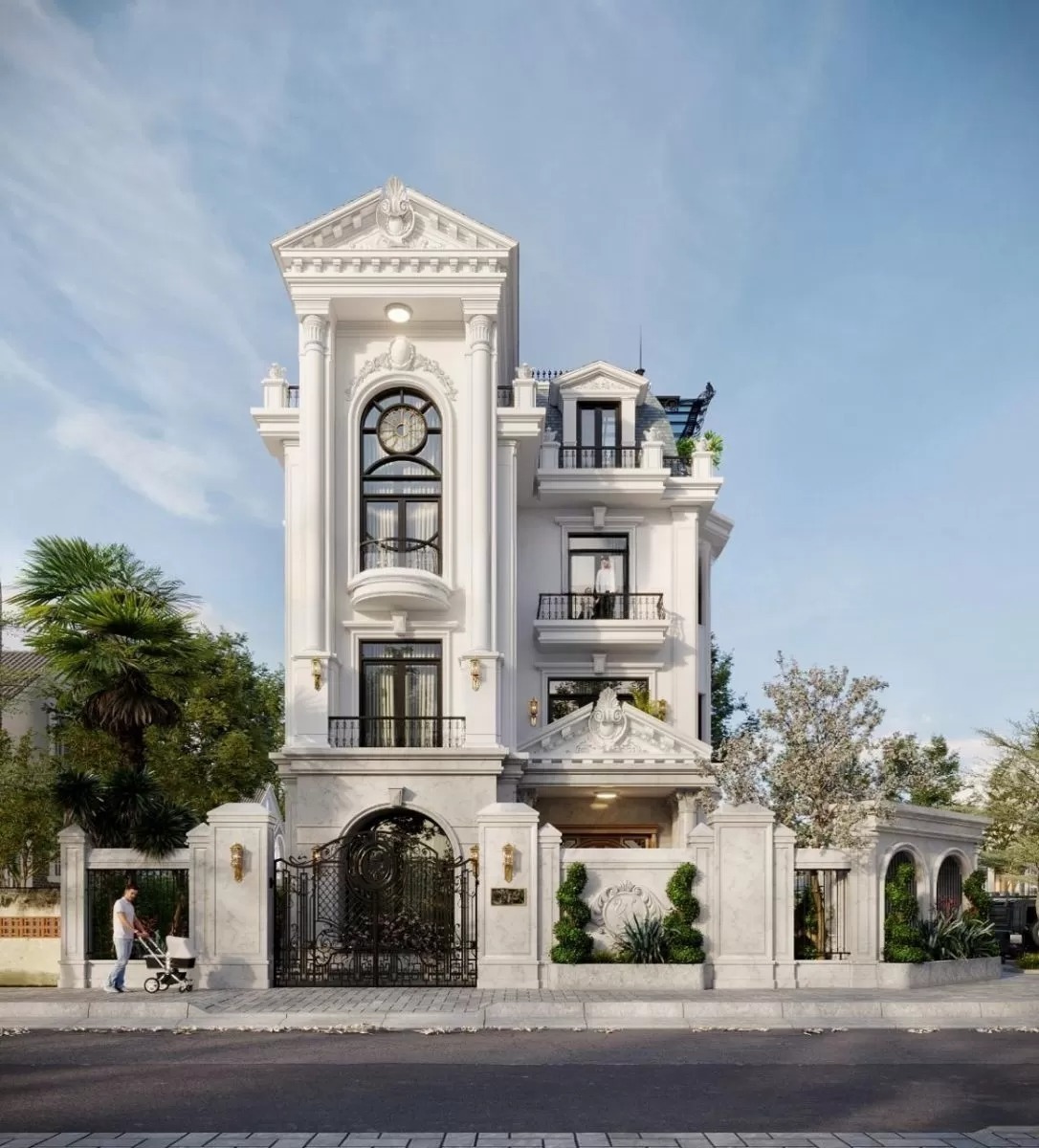 Biệt thự sang trọng phong cách tân cổ điển với cổng hoa văn tinh xảo, nền trời trong xanh, cây cối xung quanh.