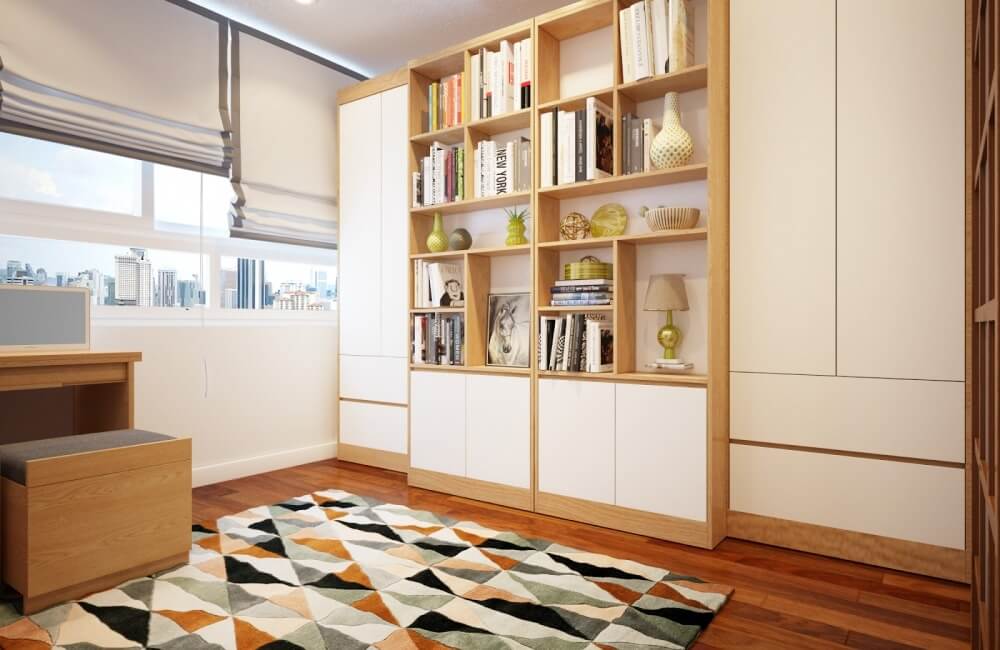 Phòng làm việc với kệ sách gỗ hiện đại, bàn làm việc nhỏ và thảm trải sàn họa tiết hình học.