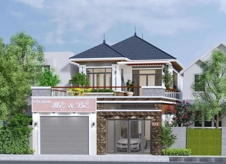 Ngôi nhà hai tầng hiện đại với cửa hàng ở tầng trệt, mái xanh, cây xanh xung quanh.