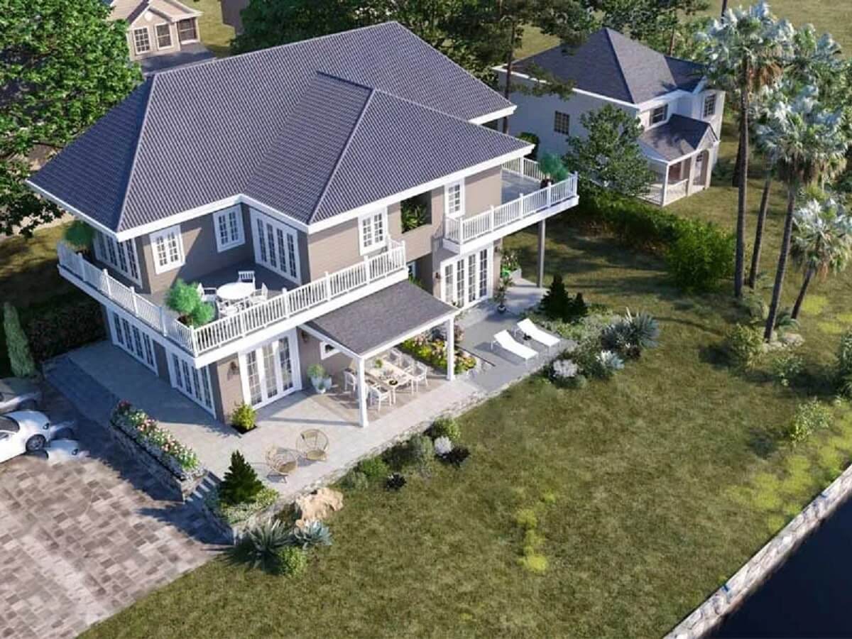 Ngôi nhà hai tầng sang trọng với sân vườn rộng và mái ngói, bao quanh bởi cây cối xanh tươi.