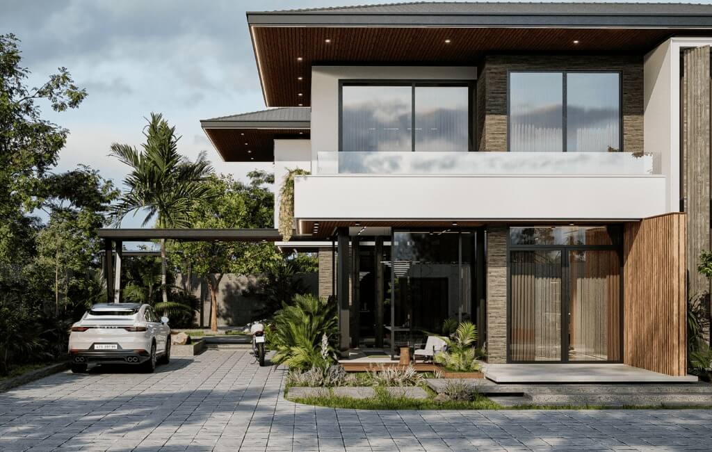 Ngôi nhà hiện đại với sân rộng và ô tô, bao quanh bởi cây xanh, bầu trời trong xanh.