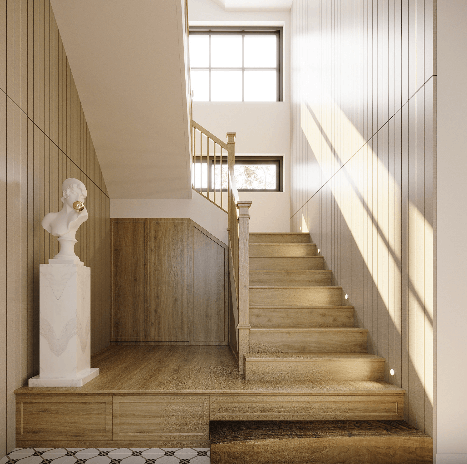 Cầu thang gỗ sáng tự nhiên với tượng bán thân, ánh sáng chiếu qua cửa sổ, nội thất tinh tế và hài hòa.