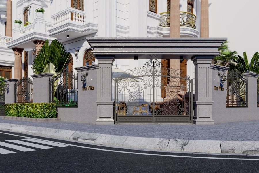 Biệt thự sang trọng với cổng lớn bằng kim loại, kiến trúc cổ điển, có cây xanh xung quanh và hàng rào trang trí.