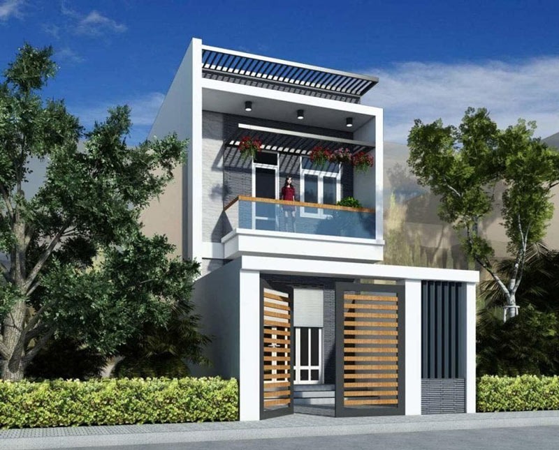 Nhà phố hiện đại hai tầng với ban công và sân nhỏ, thiết kế tinh tế giữa cây xanh, dưới ánh sáng ban ngày.