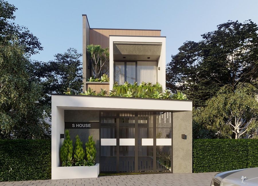 Mặt tiền ngôi nhà hiện đại hai tầng với cây xanh, cửa sổ kính lớn và cổng kim loại, bao quanh bởi thiên nhiên.