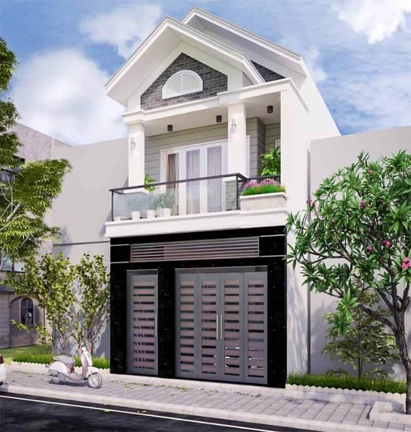 Nhà phố 2 tầng hiện đại với ban công, cửa lớn, cây xanh và xe máy trên vỉa hè bên ngoài.