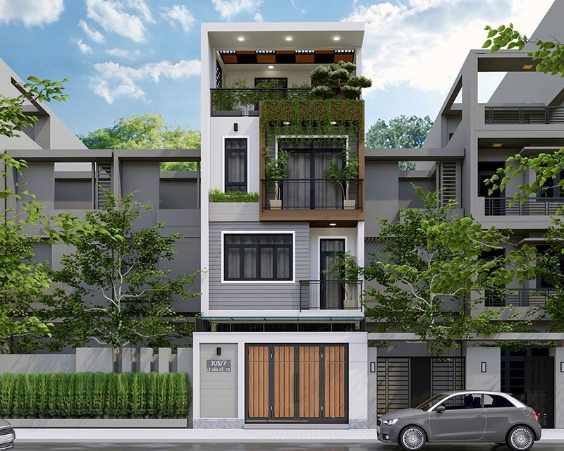 Nhà phố hiện đại với mặt tiền xanh, cây cảnh trên ban công và cửa gỗ, xe hơi đỗ trước nhà dưới trời xanh.