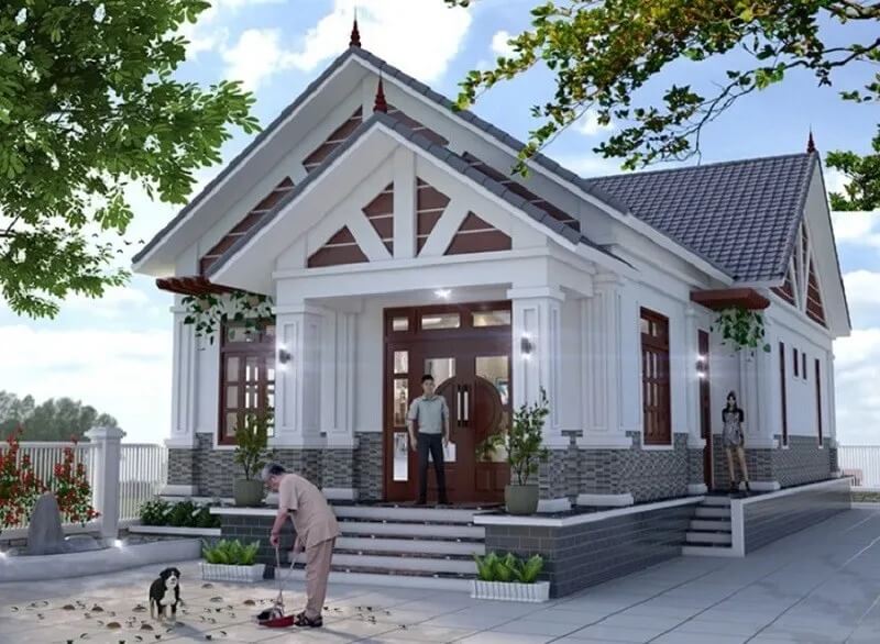 Ngôi nhà cấp 4 hiện đại với mái ngói, sân rộng và cây xanh, người đàn ông quét sân, chó đứng bên cạnh.