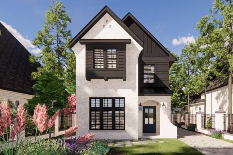 Nhà hai tầng phong cách hiện đại với tường gạch trắng và mái ngói đen, xung quanh là cây cối xanh tươi.