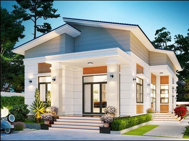 Ngôi nhà hiện đại một tầng với sân vườn, thiết kế đẹp mắt và tông màu trang nhã, bên ngoài có cây xanh và đèn chiếu sáng.