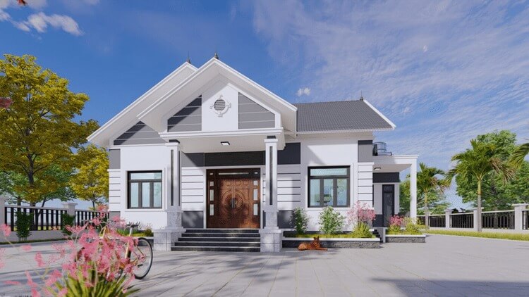 Nhà cấp 4 hiện đại với mái ngói xám, cửa chính gỗ, sân rộng và cây xanh, trời xanh nắng đẹp.