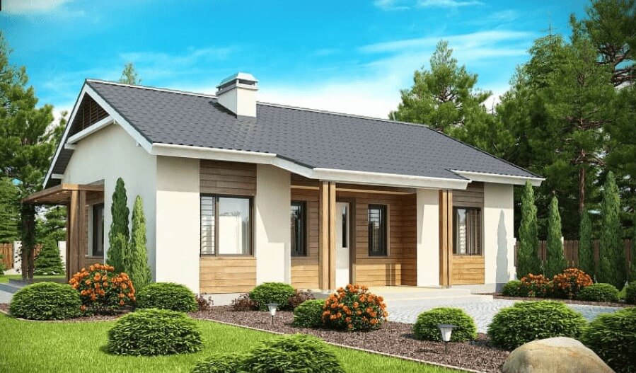 Ngôi nhà một tầng mái ngói với vườn cây xanh tươi và hoa trước sân, trời nắng đẹp.