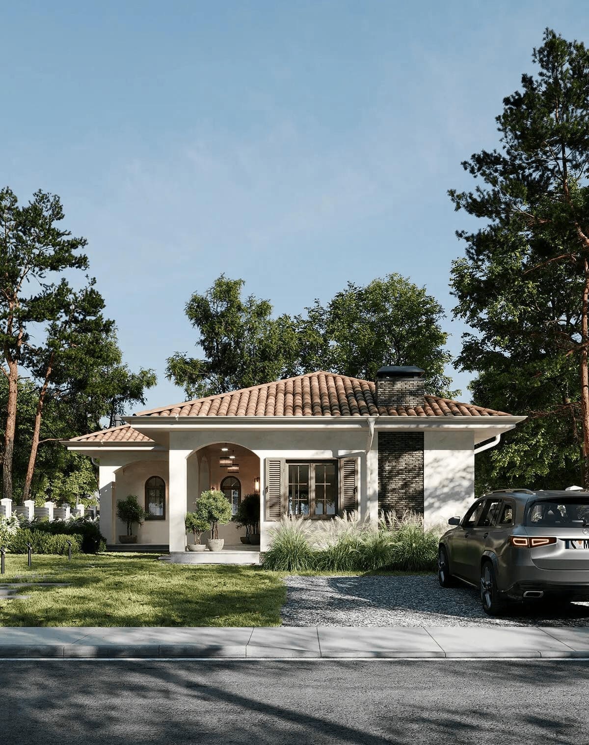 Nhà một tầng với mái ngói đỏ, xe ô tô đậu trước sân, xung quanh là nhiều cây xanh tươi mát.