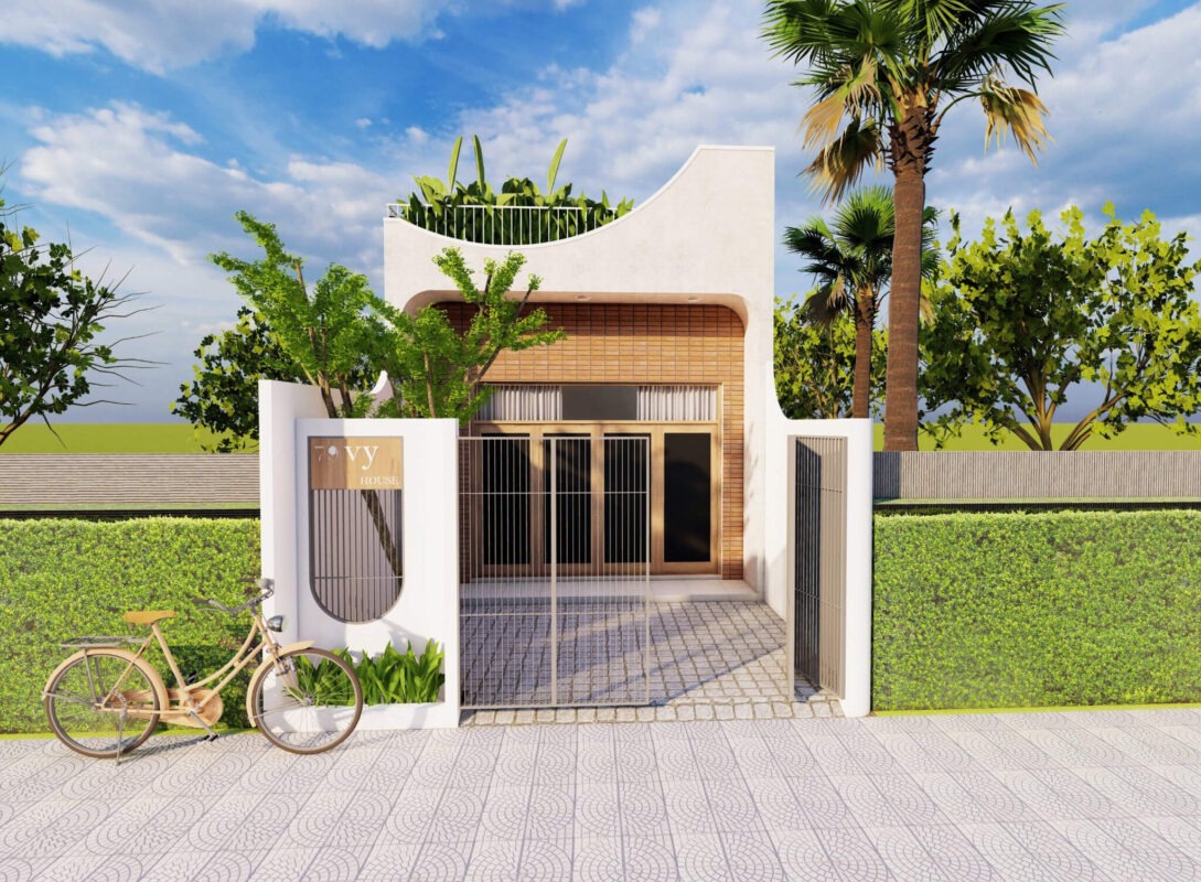 Ngôi nhà hiện đại với mặt tiền sân vườn và chiếc xe đạp gỗ phía trước, bầu trời xanh trong.