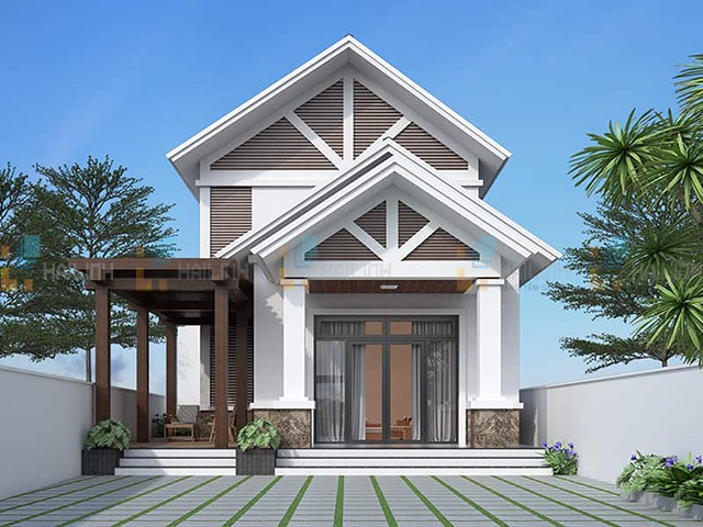 Nhà mái thái trắng hai tầng hiện đại với sân vườn và cây xanh xung quanh, bầu trời trong xanh phía sau.