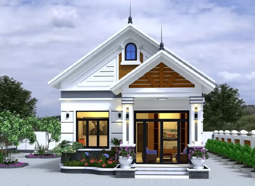 Nhà cấp 4 mái Thái, sơn trắng, sân vườn xanh tươi, cửa trước kính lớn hiện đại.