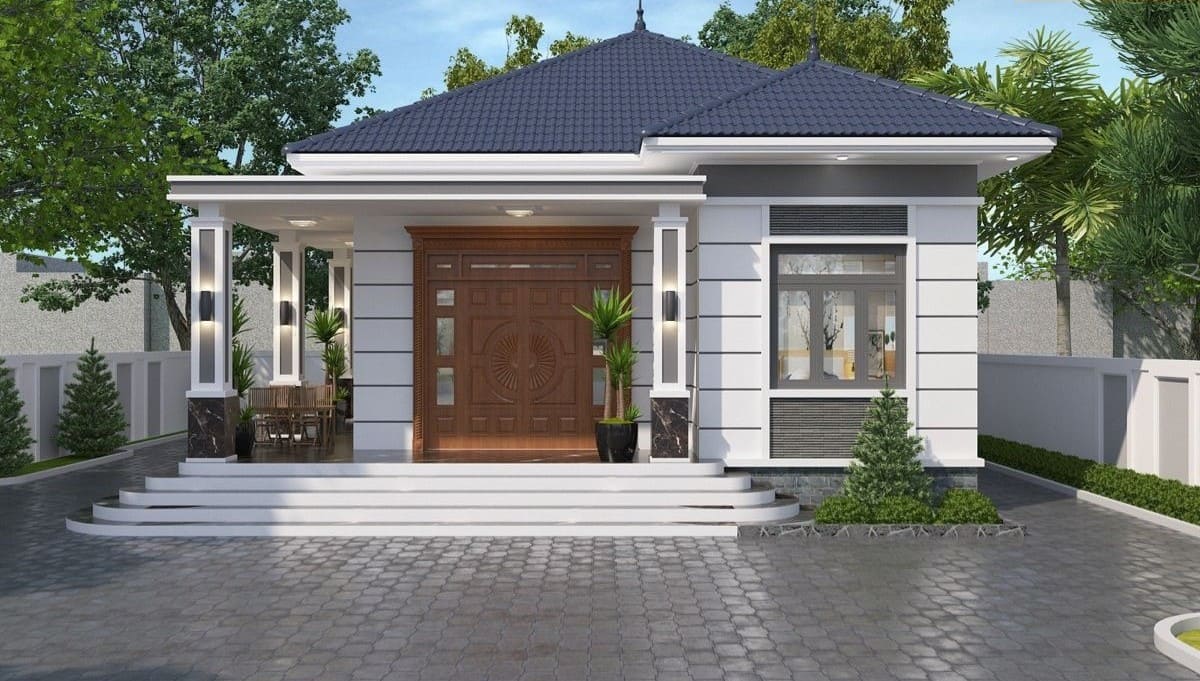 Nhà cấp 4 hiện đại với mái ngói xanh, cửa gỗ lớn và sân vườn thoáng đãng, cây xanh xung quanh.