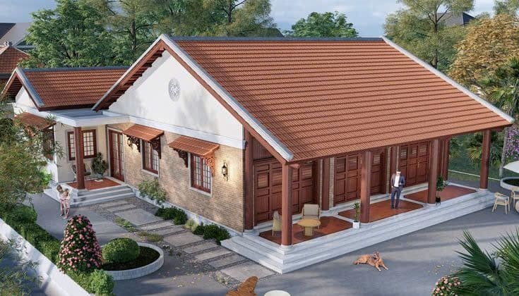 Nhà một tầng kiểu truyền thống với mái ngói đỏ, sân vườn xanh mát, và người đứng trước cửa.