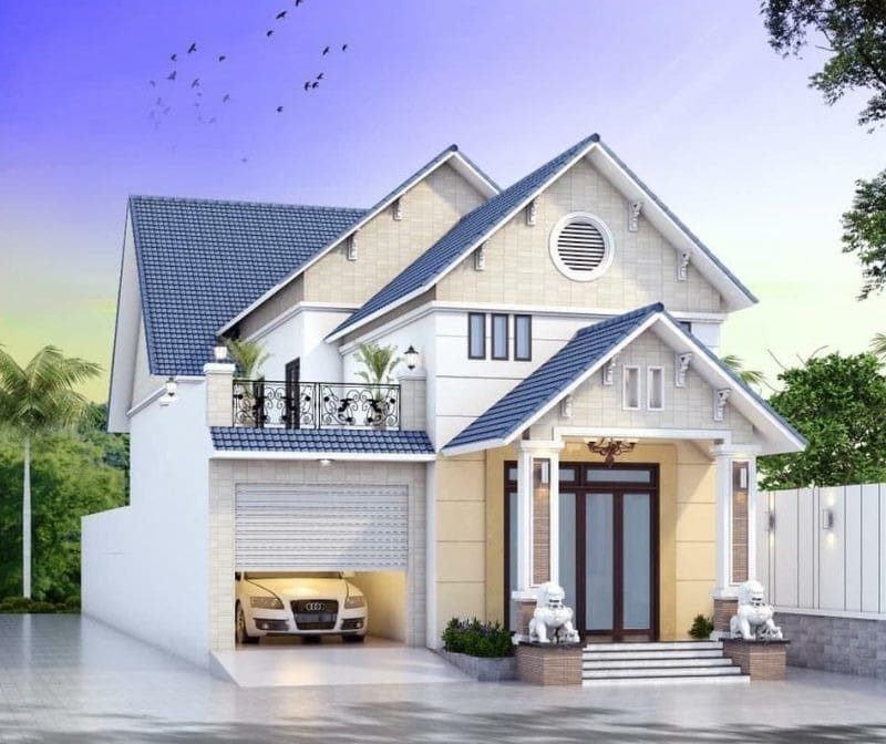 Nhà hai tầng hiện đại với mái ngói xanh, gara ô tô, sân rộng và cổng chính trang trí hai tượng sư tử trắng.