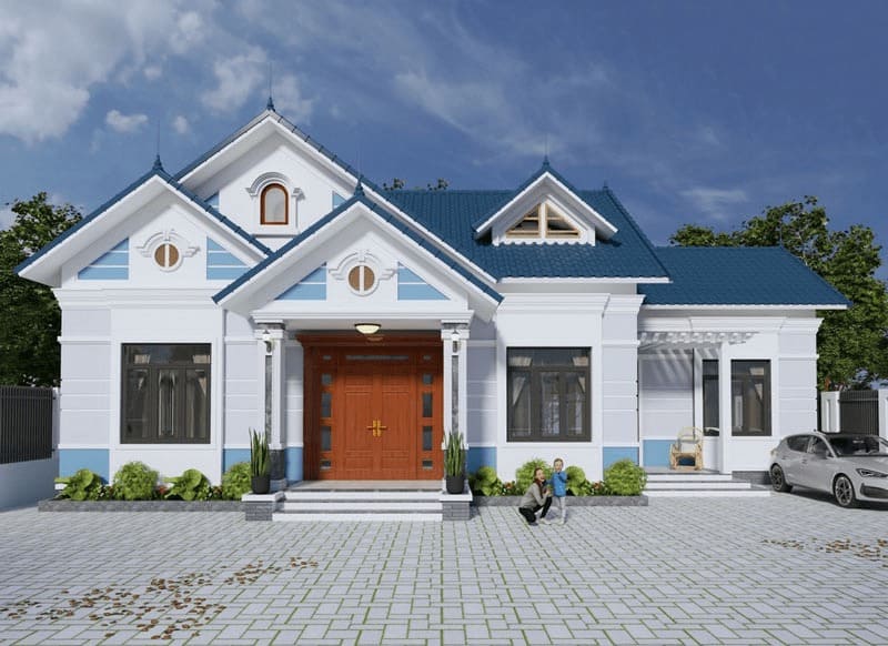 Nhà cấp 4 hiện đại có mái xanh, cửa gỗ lớn, sân rộng, cây xanh và ô tô đậu bên phải, trời có mây xanh.