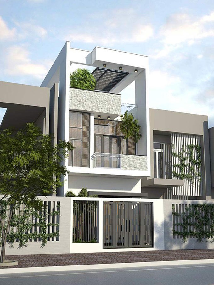 Nhà phố hiện đại màu trắng ba tầng, có cây xanh trang trí trên ban công và cửa kính.
