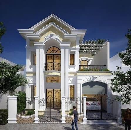 Nhà 2 tầng sang trọng với cổng sắt và kiến trúc cổ điển, màu sắc trắng và vàng tinh tế.