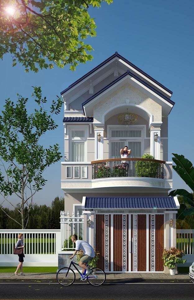 Nhà phố hai tầng hiện đại với ban công rộng, cây xanh xung quanh; người đi xe đạp trước cổng.
