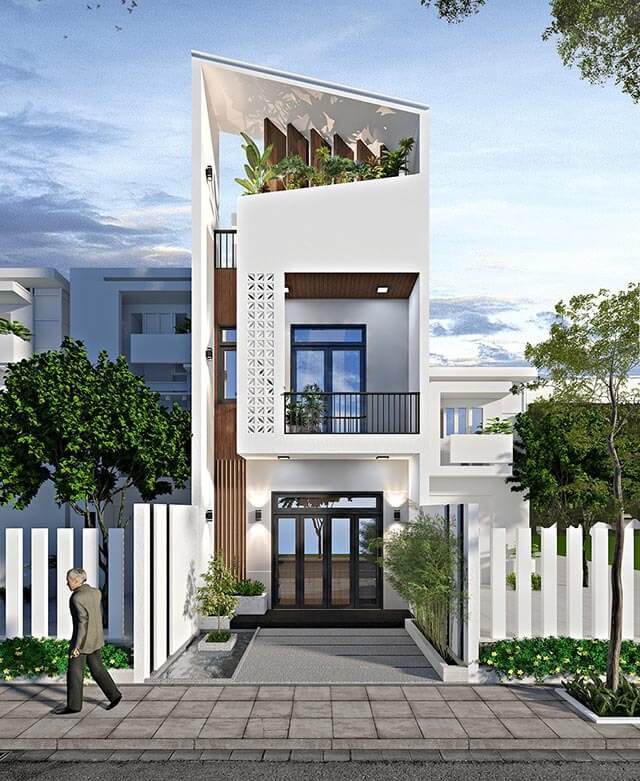 Nhà phố hiện đại 3 tầng với thiết kế sang trọng, cây xanh và cửa kính lớn, tạo không gian sống thoáng đãng.