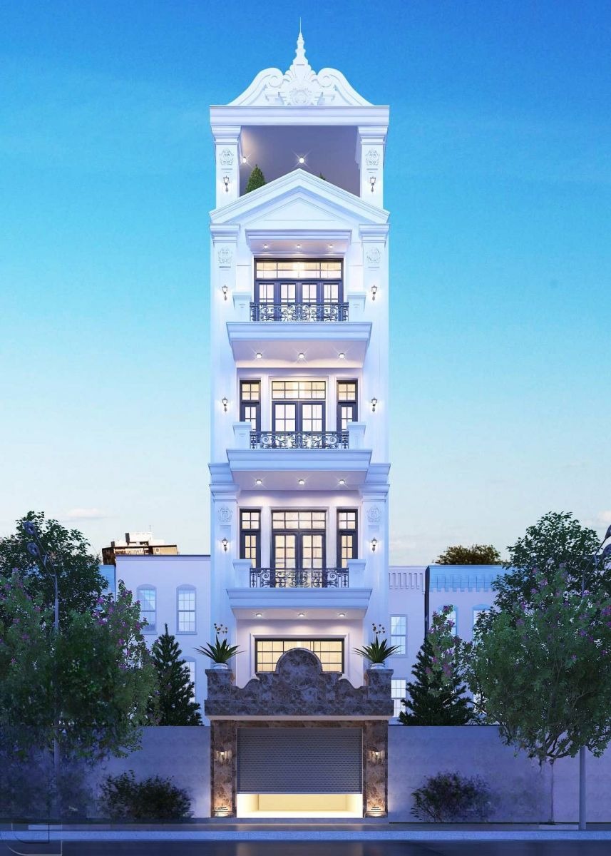 Tòa nhà 5 tầng hiện đại với thiết kế sang trọng và màu sơn trắng nổi bật trong ánh sáng ban ngày.