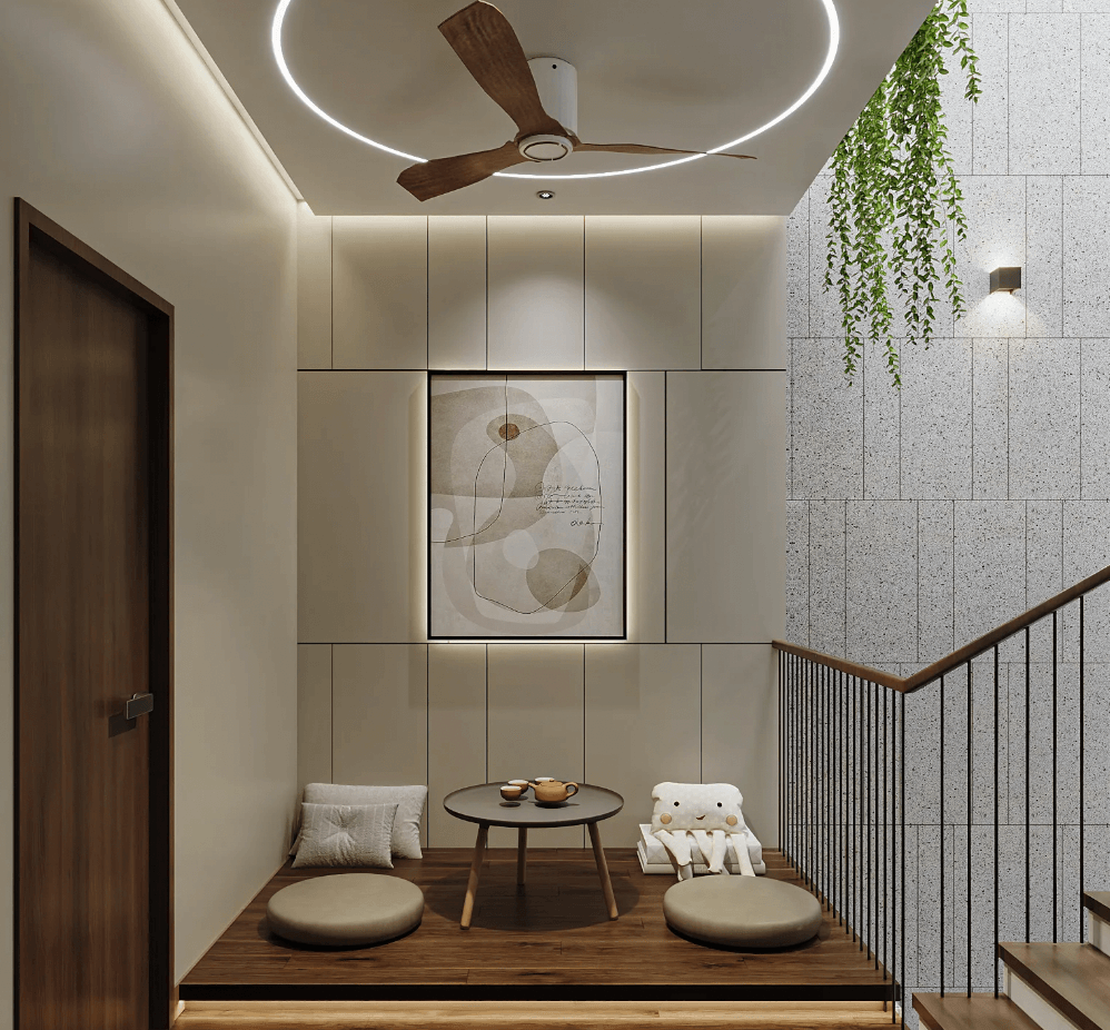 Phòng khách nhỏ gọn với ghế bệt, bàn tròn, quạt trần và tranh nghệ thuật treo tường. Không gian ấm cúng, hiện đại.